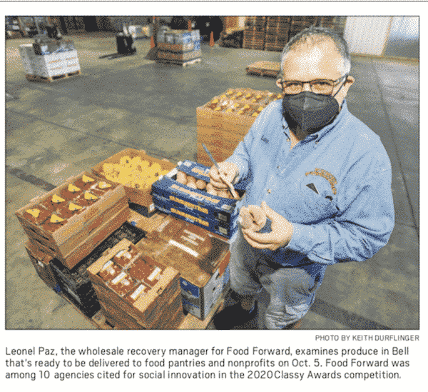 Leo with boxes of produce